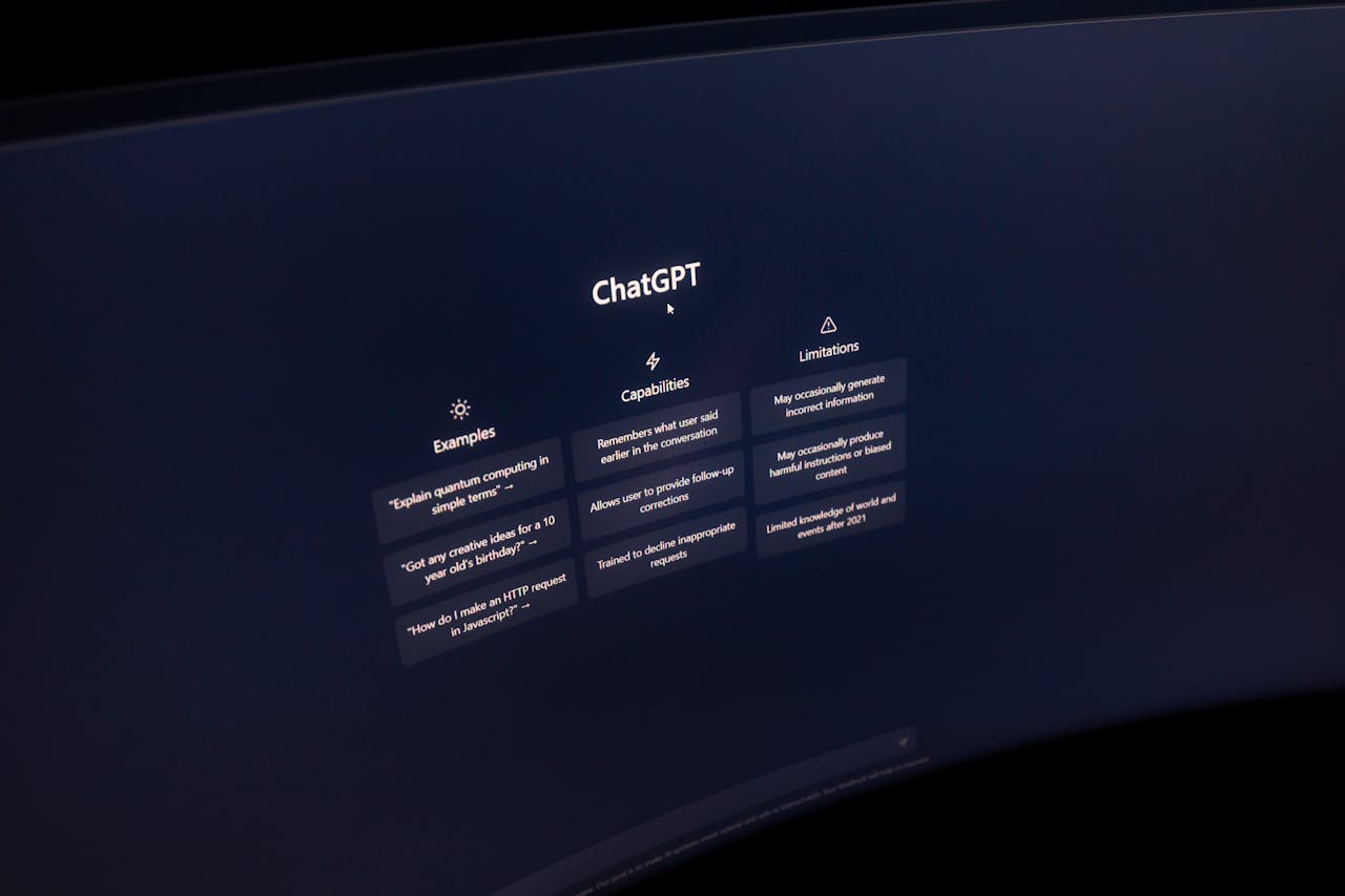 about-02 Close-up of a computer screen displaying ChatGPT interface in a dark setting.