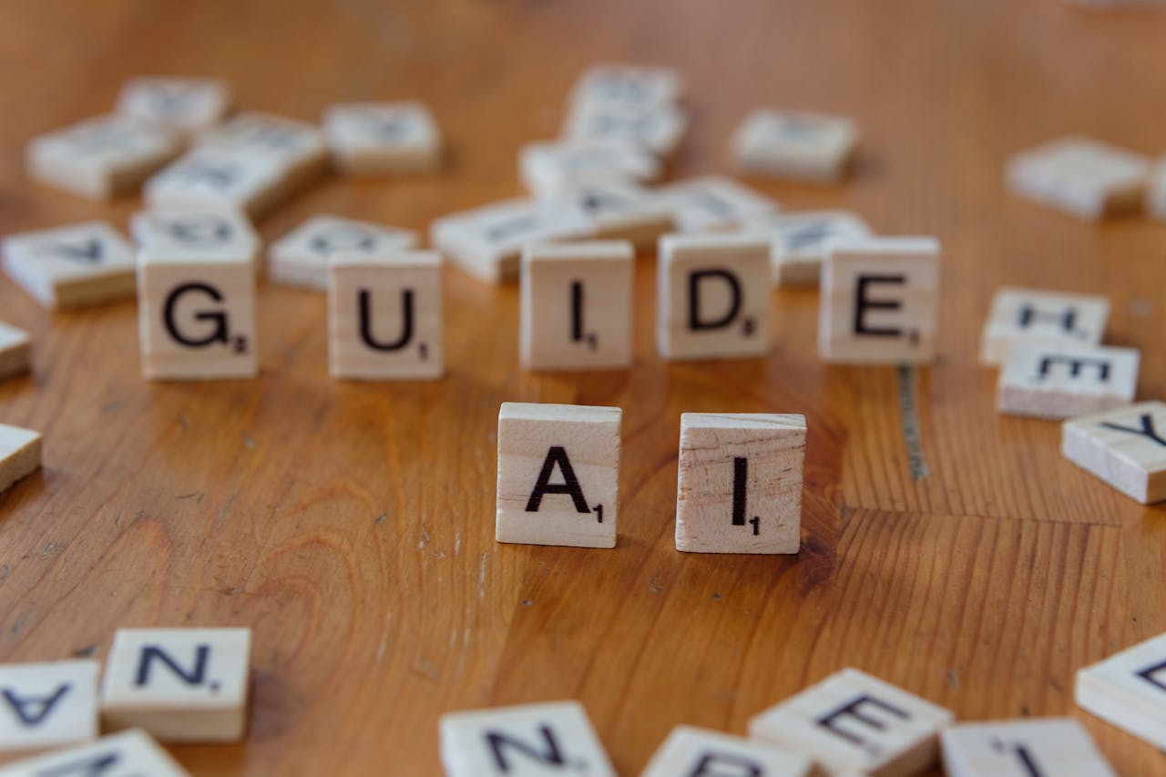 hero-img-02 Scrabble letters spelling 'GUIDE' and 'AI' on a wooden surface, suggesting direction and technology.
