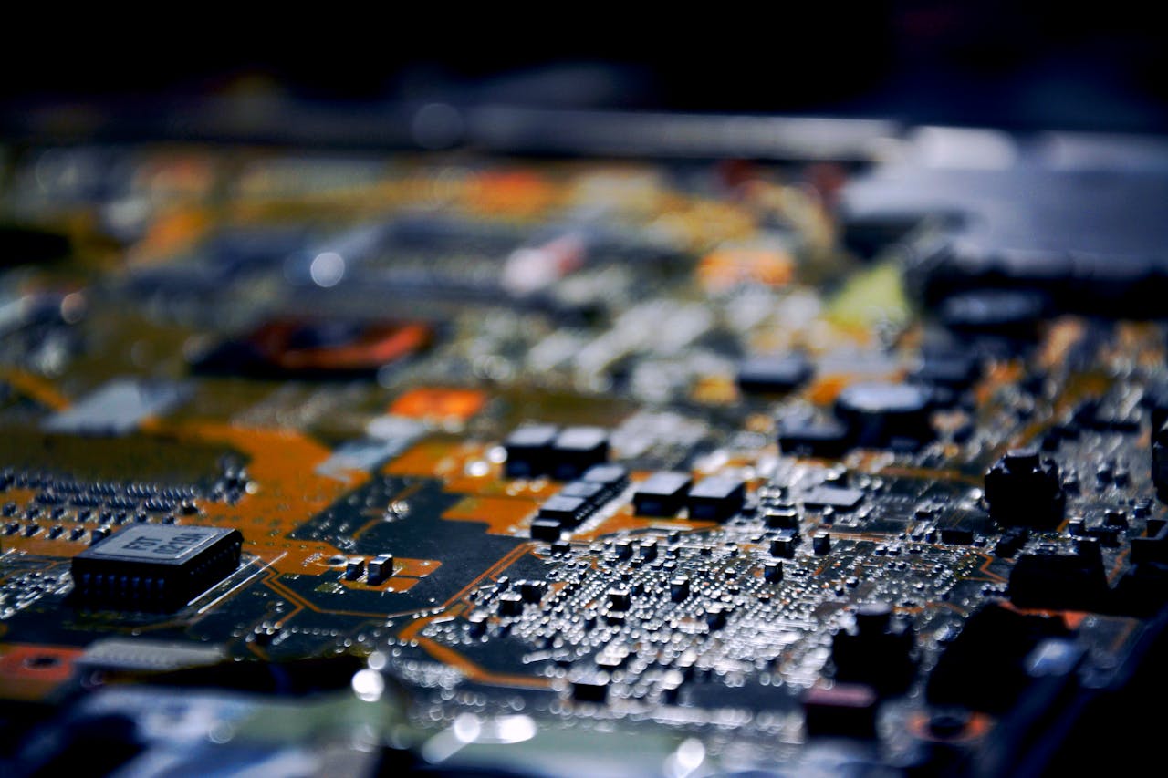 services-03 Detailed close-up view of electronic circuit board, showcasing modern technology.